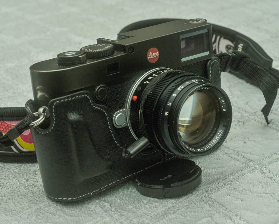 Leica M10 in black, front view on a stone surface