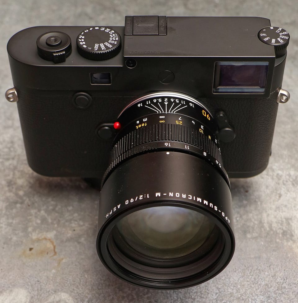 Leica M10 Monochrom with a 90 mm APO-Summicron, front view on concrete