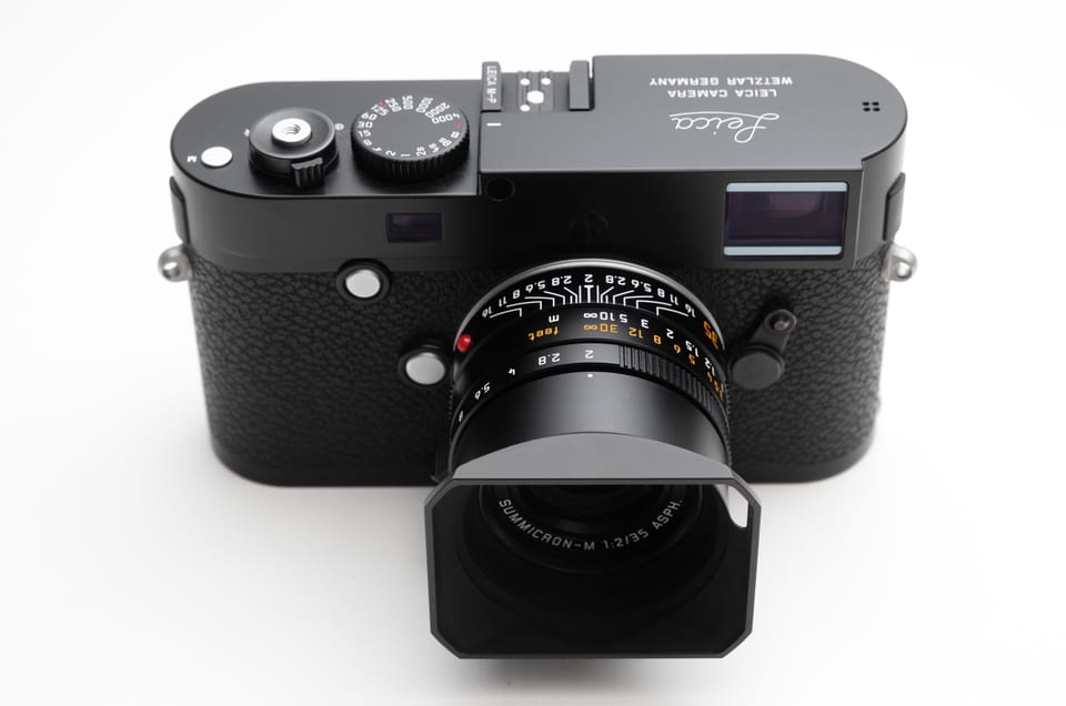 Leica M-P Typ 240 with a 35 mm Summicron, front view on white